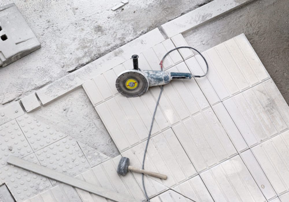 Construction tools on sidewalk under repair. Construction background