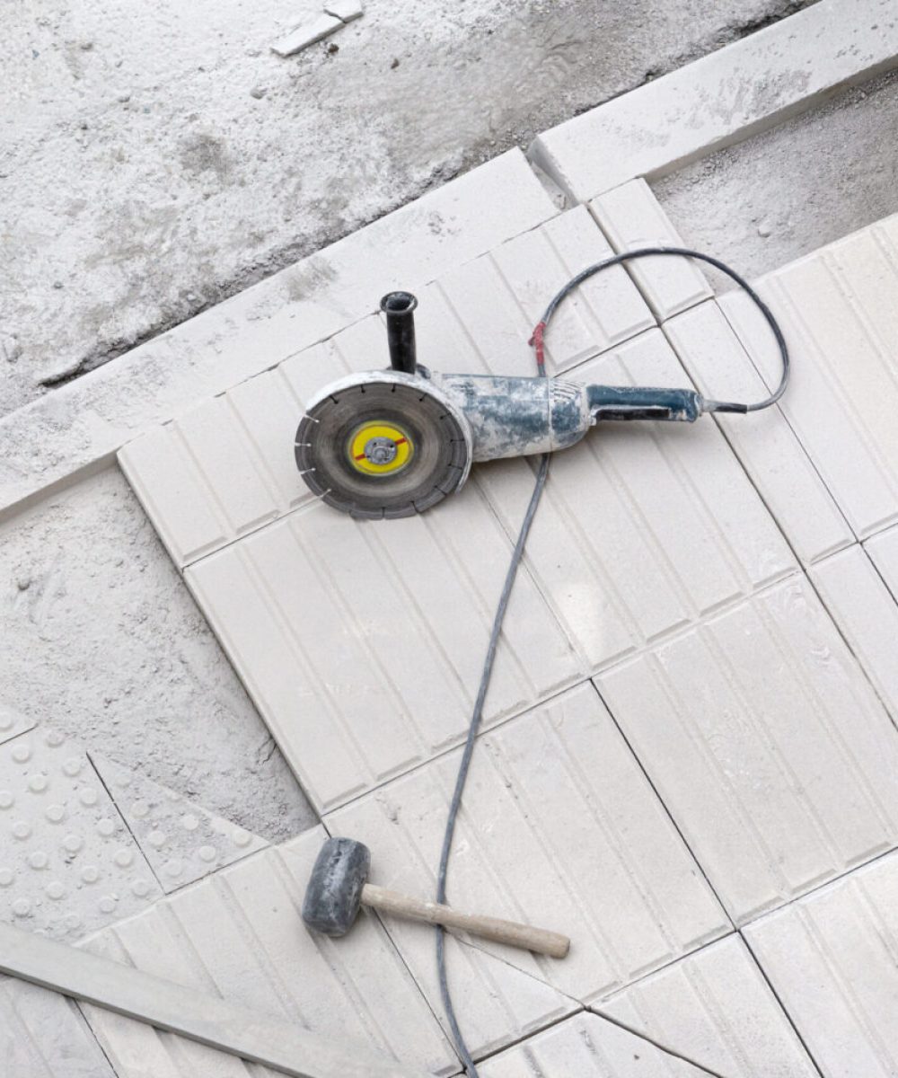 Construction tools on sidewalk under repair. Construction background
