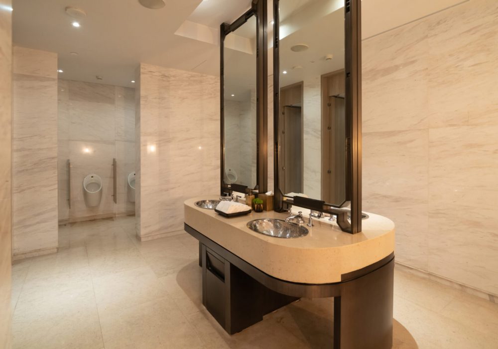 Row of modern marble ceramic wash basin in public toilet, restroom in restaurant or hotel or shopping mall, interior decoration design